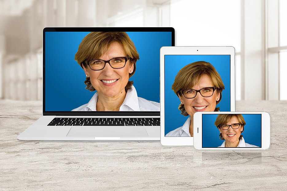 Concept image of multi device technology for responsive web design - laptop , digital tablet and smartphone in various orientation at the office (sample web page).